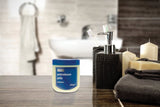 Vaseline Original Petroleum Jelly for dry skin in a 250g jar on a bathroom counter