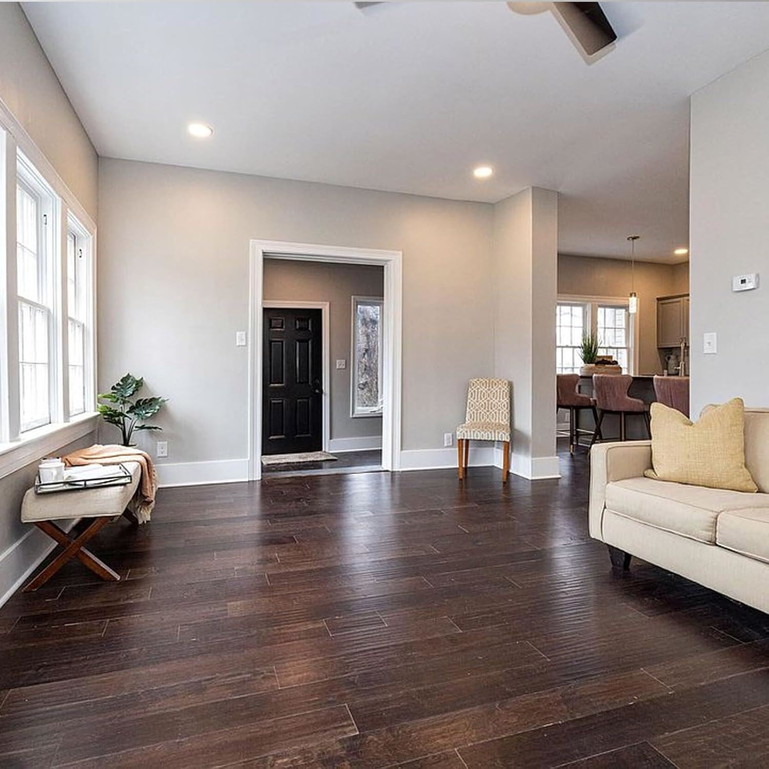 Spacious living room featuring dark oak varnish paint on the floor for a rich, warm aesthetic