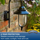 Hammerite hammered silver paint 250ml on a lamp post with floral background for exterior protection