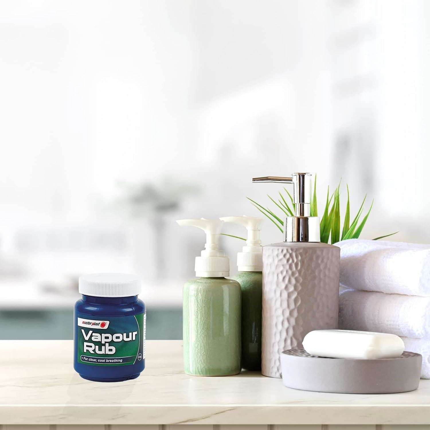 Direct Retail Outlet Vapour Rub for congestion relief on a bathroom countertop with toiletries
