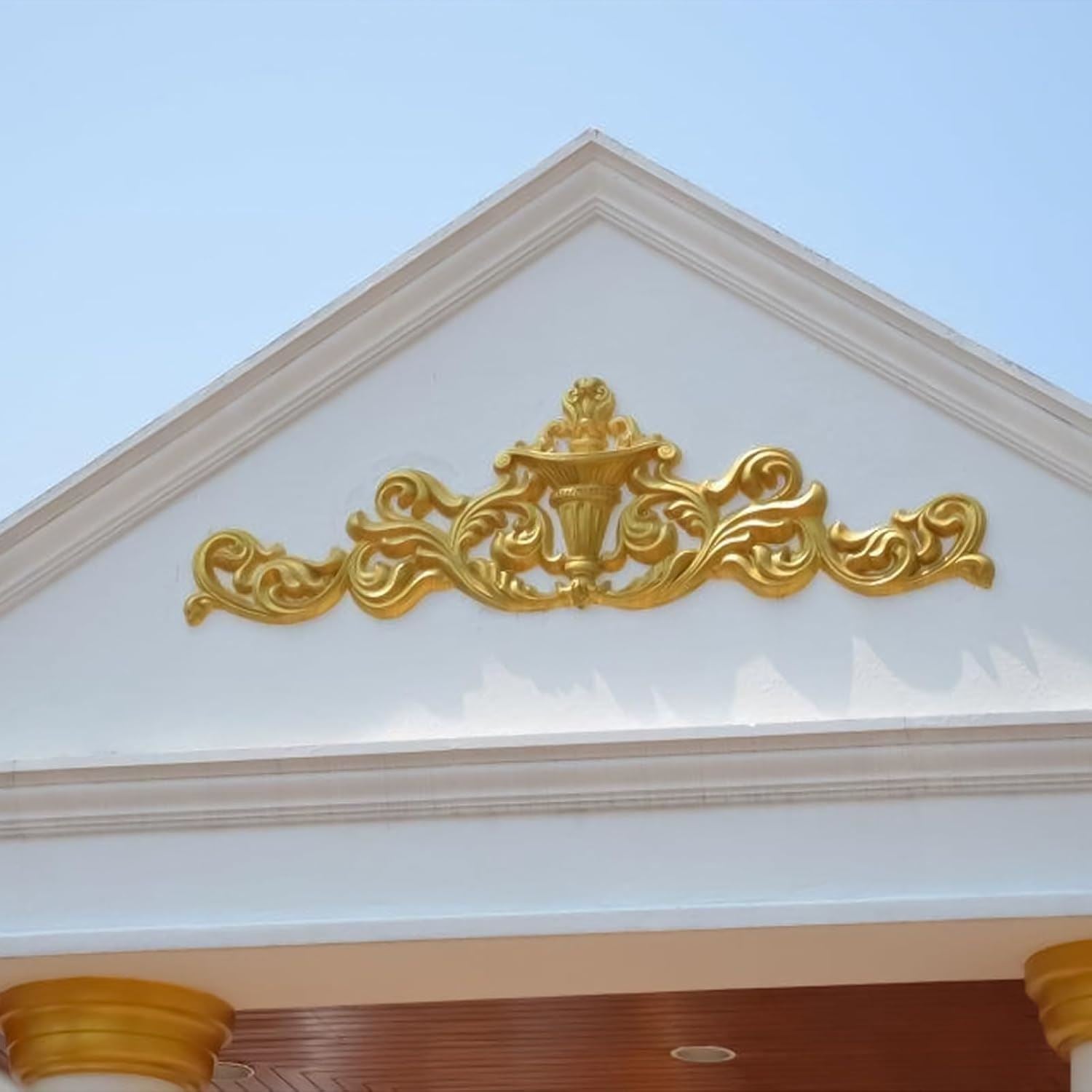 Decorative architectural detail with metallic gold paint tin finish enhancing the building's elegance