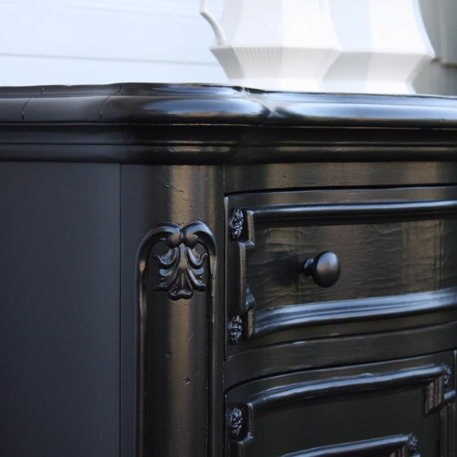 151 non-drip black gloss paint tin shown on a beautifully crafted black furniture piece