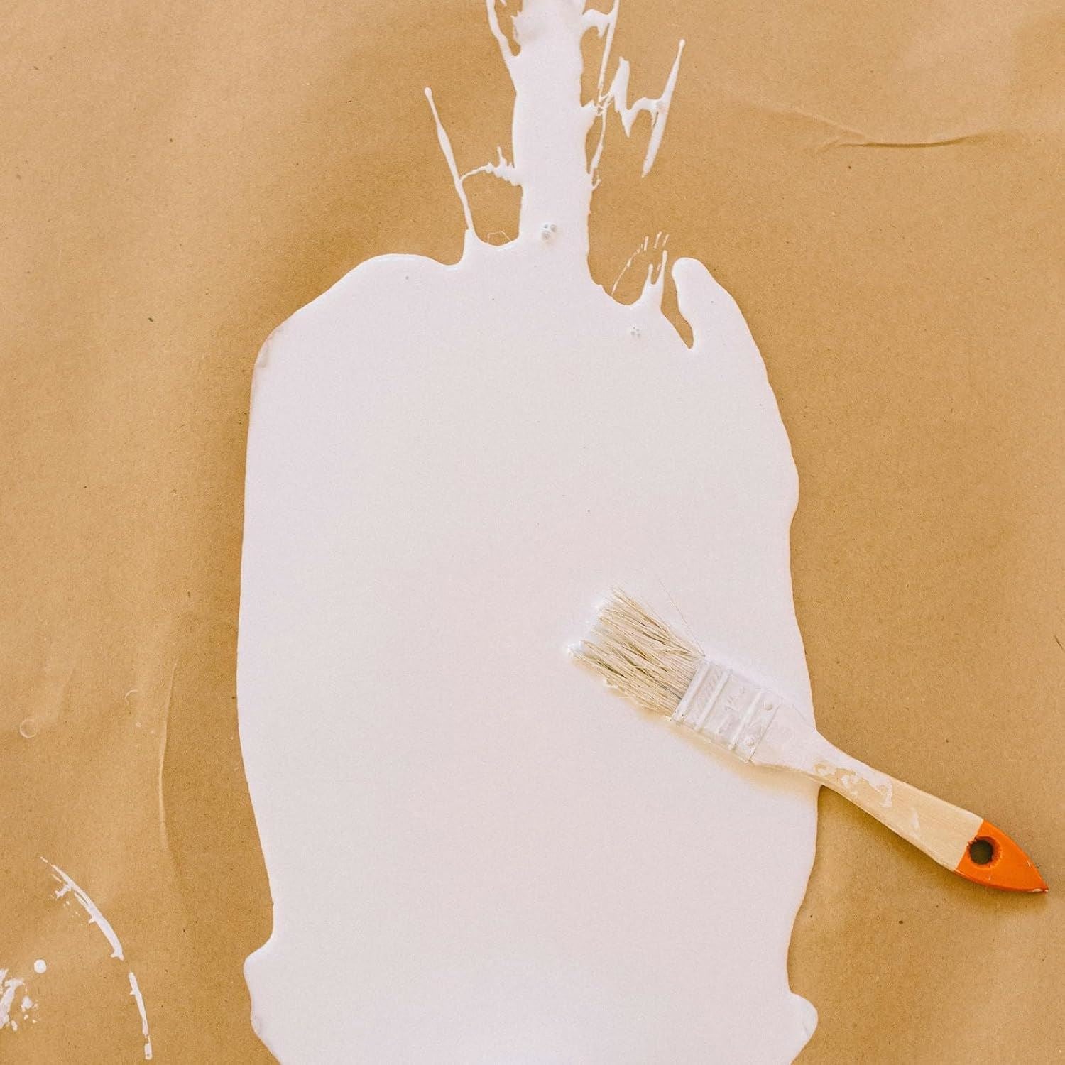 Tin of white matt undercoat paint 300ml with a brush on brown craft paper