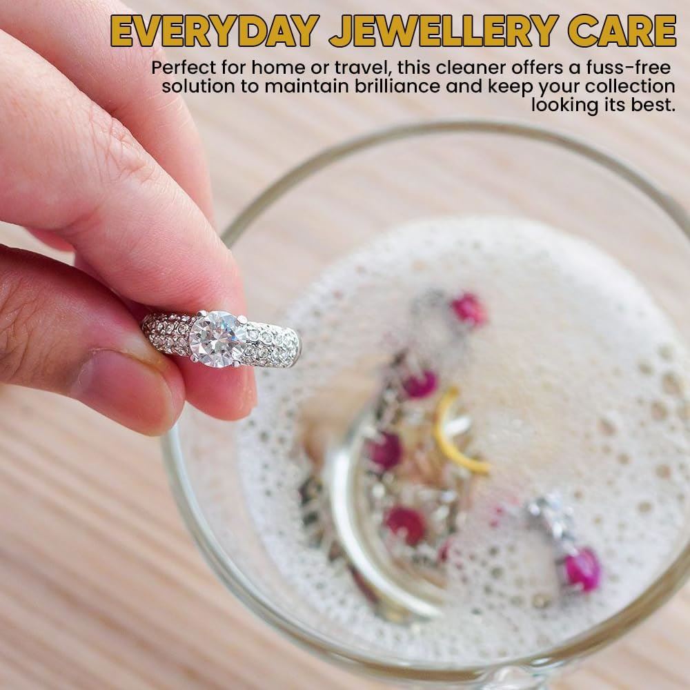 Liquid jewellery cleaner UK in use, effortlessly cleaning various sparkling rings and earrings in a glass bowl